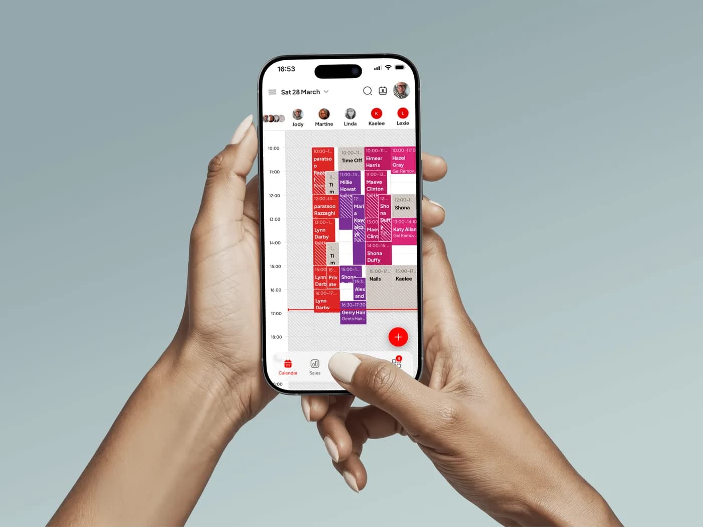 A hand holding a phone showing the Nexaloom calendar for a day of appointments.